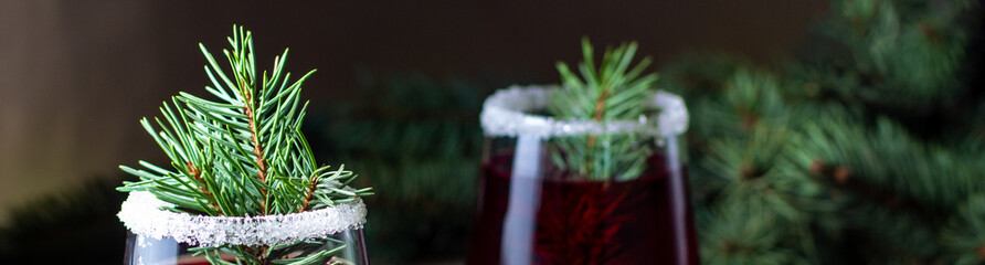 banner of Cranberry red drink decorated with fir tree branches berry and sugar. Christmas hot...