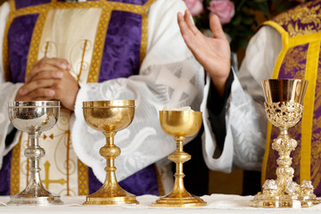 Goblet and ambula at the altar, prayer and blessing during mass