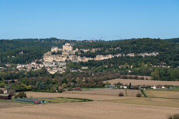 Chateau de Beynac built on top of a limestone cliff, dominating the town of Beynac-et-Cazenac and...