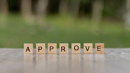 approve word Written With wood Blocks On table nature background