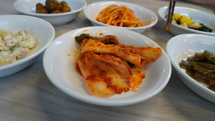 fresh cold kimchi or kimci just brought out from refrigerator served on table of the restaurant
