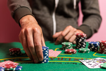 Fototapeta na wymiar The player makes a bet in poker.