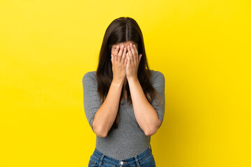 Young Brazilian woman isolated on yellow background with tired and sick expression