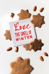 Canvas with text Love the smell of Winter levitating with star shaped cookies and freshly roasted...