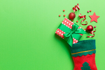 santa red sock top view on the color background with empty space. Christmas background
