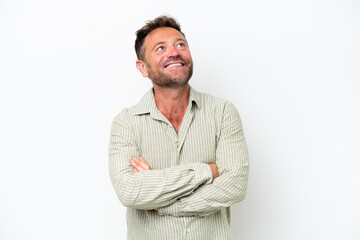 Middle age caucasian man isolated on white background looking up while smiling