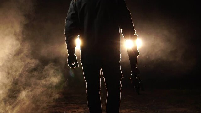 soldier in camouflage with gun of night