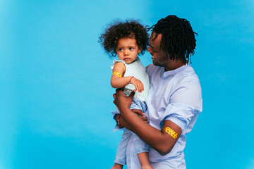 Peple gettig vaccine for covid-19 virus, vaccination against coronavirus - Black father and baby...