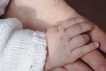 Child and mother hands together. Parental care. Concept of parenting, parental care. Motherhood