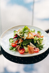 Salad blue cheese, prosciutto, arugula with spicy dressing on a light background. Healthy eating.