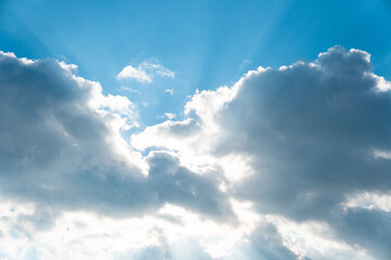 Naklejka na ściany i meble Sun rays in the cloudy sky