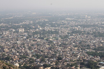Fototapeta premium Aerial view of residential houses in Alwar city, Rajasthan. Top angle Drone shot, houses in a smart city, living in India.