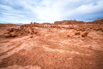 Wide angle view on hiking trail path at Goblin valley state park, Utah with nature desert valley...