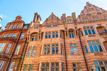 Looking up Apartment flats house building in Gothic revival architecture in Mayfair, Westminster of London UK by Park lane street road near Hyde park