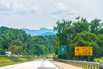 Virginia interstate highway 81 road with traffic cars trucks in summer, scenic view of Blue ridge...