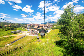 Telluride, Colorado aerial pov high angle view riding in free cable car gondola at town cityscape of mountain village town, Colorado in summer