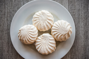 Closeup of vanilla and plain marshmallows Zephyr, zefir storebought Russian dessert from apple puree, gelatin and egg whites as traditional food