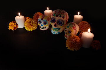 Dia de los muertos - Day of the dead Sugar skull with candles, and cempasuchil flowers altar...
