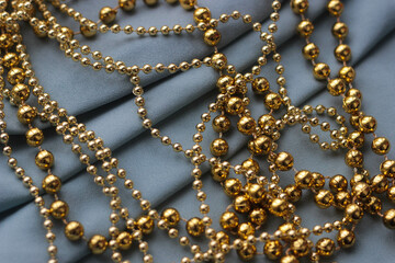 golden shiny beads for home decoration, Christmas trees for holidays and parties - new year, christmas. elegant background