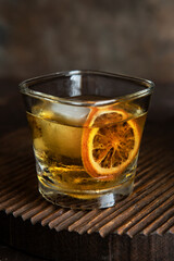 Whiskey with  ice   on  dark  background