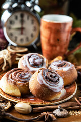 Tea mug and tasty cinnamon buns  for breakfast