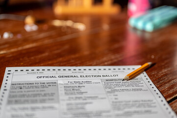 Selective focus on a generic election ballot with a pencil on top. © Lost_in_the_Midwest