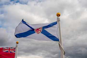 Flag of Nova Scotia waiving on a cloudy Canadian day.