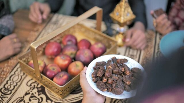  Happy Indian Muslim family celebrating Eid Mubarak and Having Eid Feast at Home