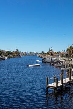 Capsized Boats In A Canal In Cape Coral After Hurricane Ian In Florida. 