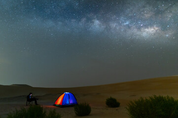 Milky way night sky in desert sand dune, night off road night camping.