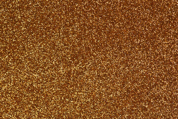 Golden shiny festive sequins. Texture for a bright design.
