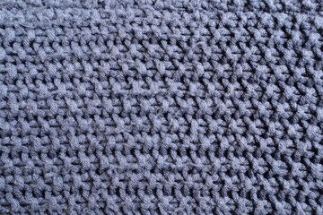 Wool knitted fabric of gray color, use for background.	