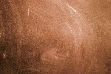 Naklejka premium Chalk rubbed out on blackboard, brown texture or background
