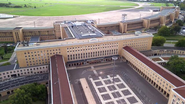 Decommissioned closed abandoned central city airport. Dramatic aerial view flight berlin
