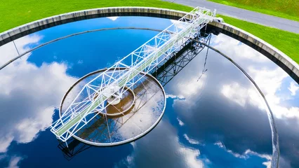 Aerial view to sewage treatment plant. Grey water recycling. Waste management theme.   © Kletr