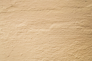 Abstract background of light brown plaster.