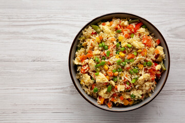 Homemade Cauliflower Fried Rice with Chives and Sesame Seeds in a Bowl, top view. Flat lay, overhead, from above. Copy space.