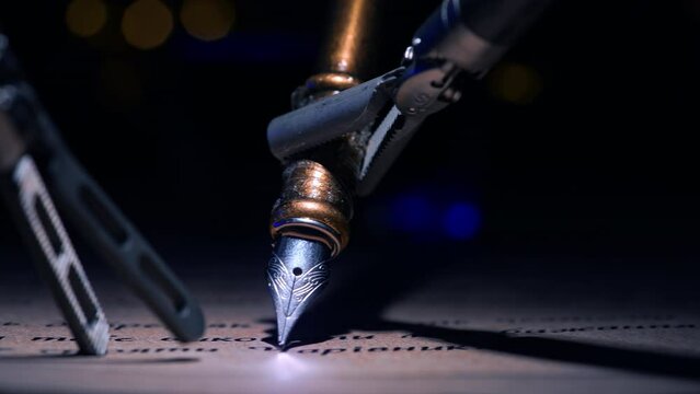Robotic forceps holding old-fashioned writing pen and move it over the paper. Precise work of the innovative futuristic equipment. Close up. Dark backdrop.