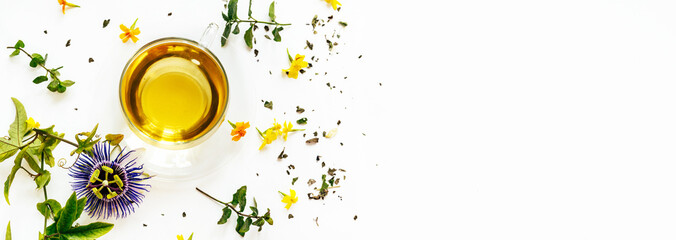 Calming herbal tea with passiflora leaves on white background with copy space. Long banner