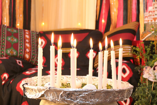 A picture of candles with eggs from the Yemeni heritage