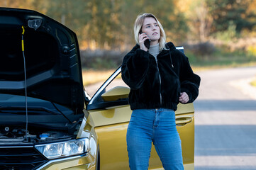A woman waiting for roadside assistance.