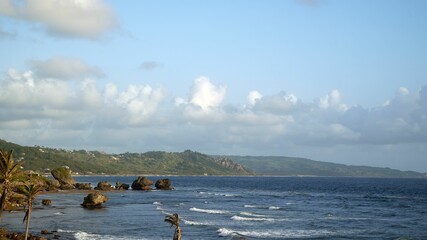 Beautiful view of rocks in a calm sea under the blue sky