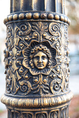Detail of a street lamp post sculpture in the streets of Paris, France