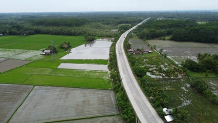 Beautiful view of a green landscape with a road and fields