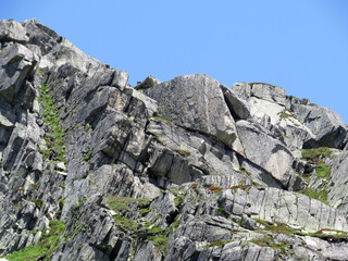 Rocks and stones in the summer Swiss Alpine environment and in the St. Gotthard pass (Gotthardpass) mountain area, Airolo - Canton of Ticino (Tessin), Switzerland (Schweiz)