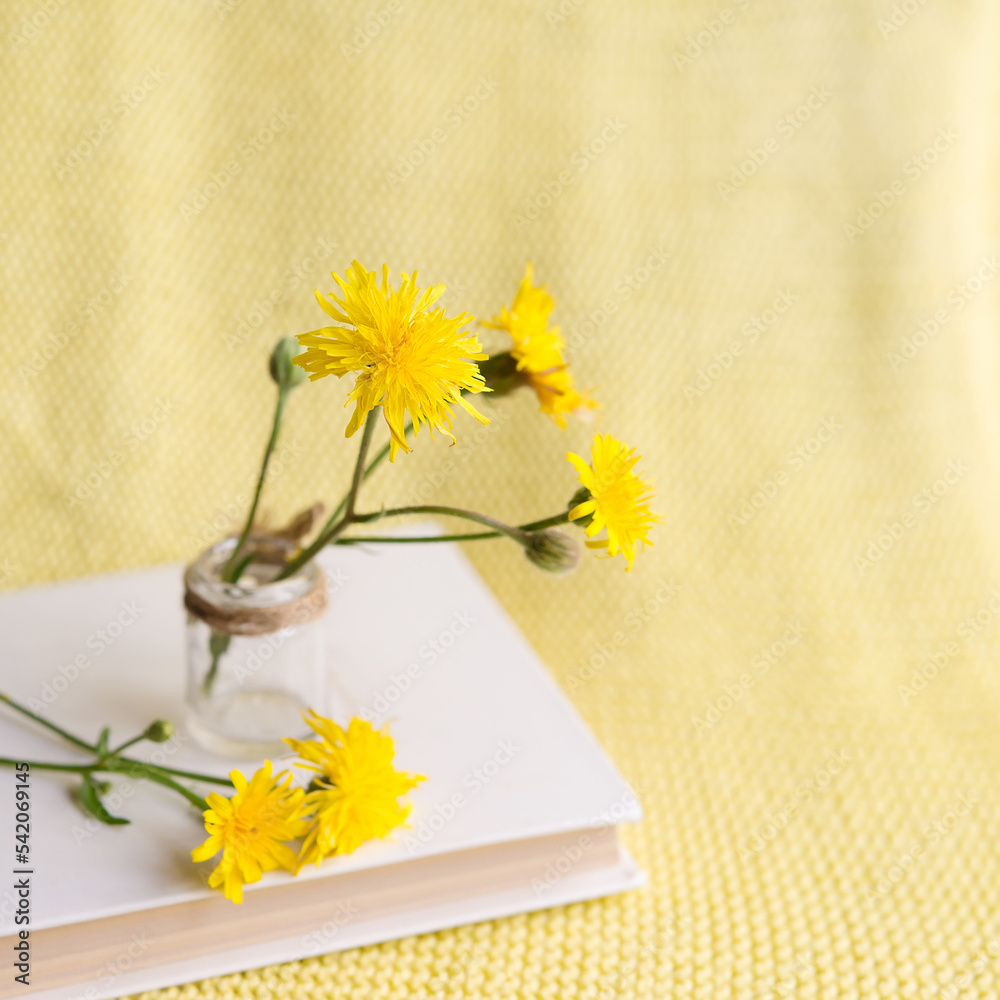 Poster yellow flower in a white book