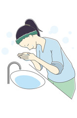 洗顔をする女性