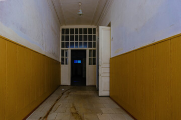 Dark and creepy corridor of old abandoned mental hospital at night