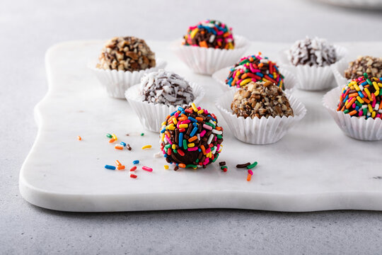 Homemade chocolate truffles covered with sprinkles and nuts