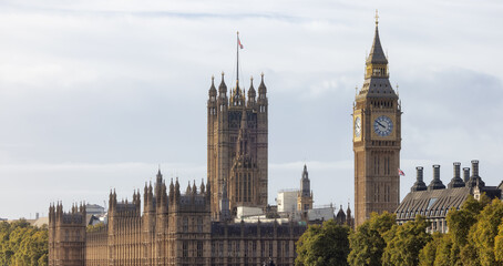 Fototapeta na wymiar Historic Landmark, Big Ben, at Palace of Westminster. Cloudy Blue Sky in Fall Season. London, United Kingdom. Travel Destination